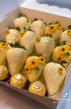 chocolate covered strawberries and sunflowers in a box