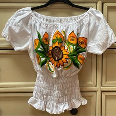 Embroidered Mexican Off-The-Shoulder Blouse Size M White Beautiful Embroidered Sunflowers Hand Wash Recommend New Without Tags Summer Embroidered Off-shoulder Blouse, Embroidered Off-shoulder Blouse For Summer, White Embroidered Off-shoulder Top, Spring Floral Embroidered Off-shoulder Tops, Floral Embroidered Off-shoulder Tops For Spring, Spring Embroidered Off-shoulder Top, Summer Off-shoulder Top With Floral Embroidery, Summer Off-shoulder Floral Embroidered Top, Summer Off-shoulder Embroidered Top