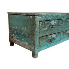 an old wooden dresser with peeling paint on the top and bottom drawers, against a white background