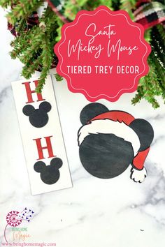 mickey mouse themed christmas tree decoration with the word'h'on it and an image of