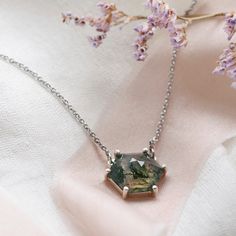 Be special with our moss agate necklace made in a delicate and minimalist style. Please choose the material and length from the drop down menu. In case if you prefer other shape or different gemstone - feel free to contact me, I will be happy to create custom hexagon shaped necklace.✨ Product details: Gemstone: Moss agate Measurements: 10x10mm Shape: Hexagon Material: 14k gold/Silver Total weight: 2.5g 🛠Handcrafted with love from our workshop in Prague.🛠 CERTIFICATION📃 Each piece of jewelry i Green Octagon Necklaces As Gift, Green Octagon Necklace For Gift, Minimalist Pendant Necklace With Natural Inclusions, Elegant Moss Agate Pendant Necklace, Hexagon Gemstone Necklace As A Gift, Hexagon Faceted Necklace For Gifts, Hexagon Faceted Necklace For Gift, Hexagonal Gemstone Necklace As Gift, Hexagon Gemstone Necklace For Gift