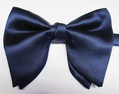 "Beautiful pre-tied and adjustable double tiered banded bow tie. Will adjust from 13\" through 20\" neck. Bow dimensions 2.5\" x 4.5\". Bow tie  Always made by hand and to your special order. Weddings and groups are welcome." Elegant Blue Ribbon Bow, Pre-tied Bow Tie Back For Party, Blue Ribbon Bow For Party, Blue Party Bow With Ribbon, Formal Blue Ribbon Bow Tie, Blue Party Bow Tie With Tie Back, Blue Tie With Decorative Bow For Parties, Adjustable Blue Bow With Ribbon, Blue Party Tie With Decorative Bow