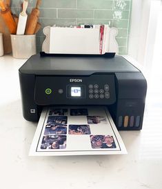 a printer sitting on top of a counter