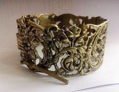 Unique Bulgarian bracelet more likely from the late 1800s. Made from bronze in traditional style with beautiful floral ornament. Came in excellent condition for the age and can be a great gift. Enough big size, will fit for any woman (and even not very large men) hand.  Rare and beautiful gift from Bulgaria! Victorian Filigree Bangle, Gold Victorian Cuff Bracelet With Intricate Design, Victorian Filigree Bracelets For Ceremonial Occasions, Victorian Cuff Bracelet With Intricate Design For Ceremonial, Victorian Cuff Bracelet With Intricate Design For Ceremonial Occasions, Victorian Style Ceremonial Cuff Bracelet With Intricate Design, Elegant Brass Cuff Bracelet With Antique Finish, Antique Gold Brass Bracelets For Formal Occasions, Formal Antique Gold Brass Bracelets