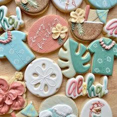 many decorated cookies are on a table