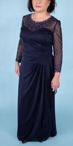 Feminine and classy. This is the perfect dress for mother of the brides or mother of the grooms. Elegant sequins and beads adorn the sleeves and neckline of this gown giving it that subtle wow factor. Brand: Alex Evenings Retail Price: $215 Color: Navy Blue Lined Hidden Zippered Back 100% Polyester Padded Model Info: Height: 5'0 Waist: 28'' Wearing a size US 6 Gala Illusion Neckline Mother Of The Bride Dress, Embellished Mother Of The Bride Dress With Fitted Bodice, Mother Of The Bride Floor-length Dress With Sweep Train, Mother Of The Bride Sequin Evening Dress, Dressy Embellished Mother Of The Bride Evening Dress, Formal Floor-length Sequined Mother Of The Bride Dress, Elegant Embellished Long Sleeve Mother Of The Bride Dress, Fitted Sequin Mother Of The Bride Dress, Fitted Sequin Evening Dress For Mother Of The Bride