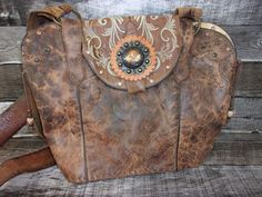 Double Cowboy Boot Purse Hand-Crafted from a Pair of Boots Tote Style (no pockets) No Two Alike Leather Body/Leather straps Western concho Leather Base Magnetic Closure Measures approx. 10"x12" FAQ's  Reviews Western Bags With Concho Detail, Western Style Bags With Concho, Western Style Brown Bags For Daily Use, Western Hand Tooled Bags For Daily Use, Western Hand Tooled Travel Bag, Western Hand-tooled Bag For Daily Use, Western Style Hand-tooled Bags For Everyday Use, Western Style Hand Tooled Shoulder Bag For Travel, Western Style Hand Tooled Brown Shoulder Bag