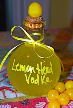 a bottle of lemon head vodka sitting on top of a table