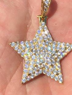 "Custom made super iced out STAR PENDANT. Made from 100% Solid 925 Sterling silver and finished in your choice of either Rhodium or 14k yellow gold. Adorned with 200 micro paved simulated diamonds (CZ) to give this piece an amazing super icy look! Measures approximately 1.25\" x 1.25\" and weighs approximately 8 grams. You can buy pendant only or with choice of 18-30\" 2.5mm diamond cut ball moon chains IF YOU WANT PENDANT ONLY, SELECT \"0\" Chains are also solid sterling silver and come with a Dazzling Star-shaped Cubic Zirconia Jewelry, Dazzling Star-shaped Sparkling Jewelry, Dazzling Sparkling Star Jewelry, Sparkling Sterling Silver Star Jewelry, White Star-shaped Cubic Zirconia Jewelry, Dazzling Silver Star Jewelry, Dazzling Star-shaped Jewelry Gift, Dazzling Star-shaped Jewelry For Gifts, Sparkling Star-shaped Jewelry Gift