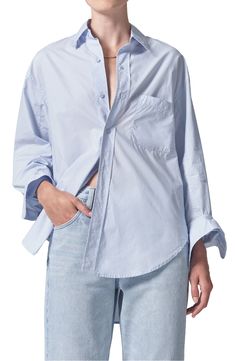 Crisp cotton poplin breaks away from its tailored reputation with this oversized button-up shirt featuring billowy sleeves and a high-low hem. 23" to 31" length (size Medium) Front button closure Spread collar Long sleeves with button cuffs Chest patch pocket 100% cotton Machine wash, tumble dry Imported Oversized Poplin Tops For Spring, Summer Long Sleeve Poplin Shirt, Chic Spring Poplin Shirt, Chic Poplin Button-up Shirt, Spring Poplin Shirt With Button Closure, Daywear Poplin Tops With Button Closure, Oversized Shirt With Cuffed Sleeves For Daywear, Daywear Tops With Button Closure, Poplin Tops With Button Closure For Daywear