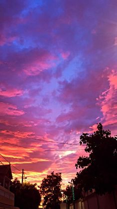 the sky is purple and pink with clouds