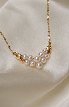 * Necklace Material: Pearl, 18K Yellow Gold * Necklace Dimensions: 16inches chain, 1inch pendant length * Stone Weight & sizes: 10 Pearls 5-4.1mm * Overall weight: 4.7g Elegant Round Gold Plated Chain Necklace, Gold Akoya Pearl Necklace In Timeless Style, Elegant Gold Plated Round Pearl Necklace, Elegant Gold-plated Round Pearl Necklace, Yellow Gold Pendant Necklace 16 Inch, Exquisite Yellow Gold Pendant Pearl Necklace, Exquisite Akoya Pearl Round Necklace, Elegant 14k Gold Chain Necklace For Anniversary, White Pendant Chain Necklace For Formal Occasions