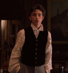 the young man is wearing a vest and bow tie in this scene from the movie