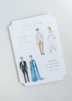 a paper cutout of two people in formal wear and the words dress code on it