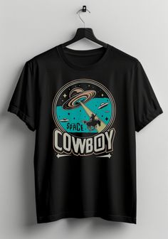 Ride into the cosmos with style in our UFO "Space Cowboy" Shirt! This unique and funny t-shirt combines classic cowboy charm with an extraterrestrial twist, featuring a retro-inspired design of an alien as a space cowboy. It's the perfect blend of humor and sci-fi, making it a standout piece in any wardrobe. Crafted from high-quality, soft cotton, this shirt offers both comfort and durability for everyday wear. The vibrant graphic print is designed to catch eyes and spark conversations, showcasi Cowboys And Aliens Tshirt, Funny Alien, Retro Cowboy, Alien Shirt, Classic Cowboy, Space Cowboy, Aliens Funny, Space Cowboys, Cowboy Shirt