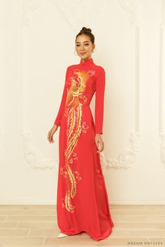 Make a bold, royal statement adorned in our Yedda red bridal ao dai with phoenix embroidery. There's no better combination than red and gold; you will look and feel like royalty adorned in this piece. A gorgeous custom embroidery phoenix features intricate, dainty details that are simple mesmerizing. Detail: Traditional Vietnamese Red Ao Dai Custom embroidery Phoenix Collar: 1.8in/ 4.5cm Long sleeves Zipper closure Red pants Made to order Red Dress With Gold Embroidery For Traditional Ceremonies, Red Fitted Ao Dai For Traditional Ceremonies, Traditional Red Ao Dai For Ceremony, Embroidered Ao Dai For Traditional Ceremonies, Ceremonial Fitted Embroidered Ao Dai, Red Traditional Ao Dai For Ceremonies, Traditional Red Ao Dai For Ceremonies, Red Ao Dai For Traditional Ceremonies, Red Dress With Gold Embroidery For Festive Season