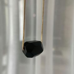 Made with beautiful black obsidian gemstone, this necklace is not only stylish but also has a meaning. Obsidian is known as a stone of protection, helping to shield you from negativity. It's also said to promote strength and courage, two qualities that we could all use more of in our lives. So not only will you look great wearing this black obsidian necklace, but you'll also feel great knowing that you're wearing something with such positive energy. Whether you're treating yourself or someone else, Black Obsidian Necklace makes for a perfect gift.

 	Size: 18 inches
 	Free Shipping 2 Days
 	Authentic Stone Black Obsidian Black Onyx Crystal Necklace With Black Beads, Black Spiritual Crystal Necklace With Gemstone, Spiritual Black Gemstone Crystal Necklace, Spiritual Black Crystal Necklace With Gemstone, Black Gemstone Crystal Necklace For Spiritual Use, Black Faceted Everyday Jewelry, Black Faceted Jewelry For Everyday, Everyday Black Faceted Jewelry, Black Crystal Pendant Necklaces For Meditation