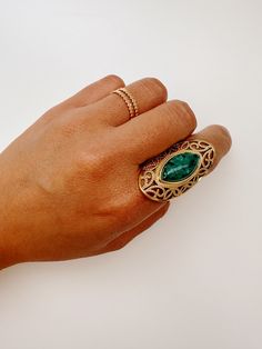 This elegant Jasmine Turquoise Ring is perfect for those with sensitive skin, as it is hypoallergenic. Its tarnish-free finish and waterproof design make it a long-lasting statement piece. The African turquoise stone adds a touch of boho style to any outfit. Bohemian Style Adjustable Oval Emerald Ring, Bohemian Oval Emerald Ring Adjustable, Handmade Bohemian Gold Turquoise Ring, Bohemian Gold Turquoise Open Ring, Bohemian Handmade Open Emerald Ring, Adjustable Bohemian Green Emerald Ring, Adjustable Green Emerald Bohemian Ring, Handmade Bohemian Emerald Open Ring, Adjustable Green Bohemian Emerald Ring