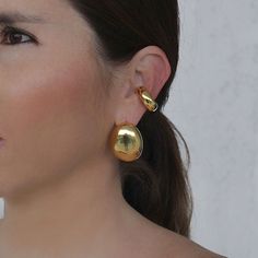 Materials: 18k gold-plated Brass. Size: 3cm x 2.2cm Every piece is handmade with love by Colombian artisans.Designed in New York, Handmade in Colombia.Lina Hernandez Jewelry Gold 14k Wedding Ear Cuff, Gold Plated Clip-on Plug Earrings, Gold Plated Teardrop Clip-on Jewelry, Classic Gold-plated Yellow Gold Ear Cuff, Gold Clip-on Sterling Silver Jewelry, Gold 14k Round Ear Cuff, Classic Yellow Gold-plated Ear Cuff, Single Gold-plated Round Ear Cuff, Elegant Pendant Plated Earrings