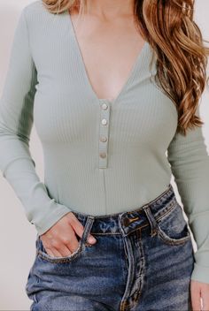 Details: Snap button v neck bodysuit Ribbed cotton Pistachio color Sizing: Runs small, size up Model wearing size medium Pistachio Color, V Neck Bodysuit, Ribbed Bodysuit, Chic Boutique, Pistachio, Snap Button, Size Medium, V Neck, Boutique