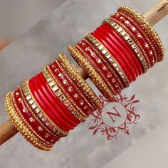 Zari Work Bangle For Parties And Festivals, Red Kundan Bangle With Zari Work, Bollywood Style Red Jewelry With Dori Work, Red Bollywood Jewelry With Dori Work, Red Kundan Party Sets, Festive Embroidered Bangle For Festivals, Red Gota Work Bangle For Festivals, Red Gota Work Bangle For Festivities, Red Gota Work Jewelry For Navratri