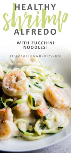 shrimp alfredo with zucchini noodles and spinach on a white plate text reads, healthy shrimp alfredo with zucchini noodles