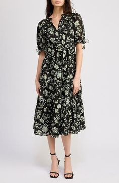 An effervescent floral pattern blossoms on a belted midi dress complete with impeccable puff sleeves. 44" length (size Medium) Front button closure Split neck Short sleeves Removable tie belt Partially lined 98% polyester, 2% spandex Hand wash, line dry Imported Spring Floral Print Mid-length Puff Sleeve Dress, Spring Mid-length Puff Sleeve Dress With Floral Print, Elegant Midi-length Puff Sleeve Dress With Floral Print, Floral Print Midi Puff Sleeve Dress For Daywear, Floral Print Puff Sleeve Midi Dress For Daywear, Midi Puff Sleeve Floral Dress For Daywear, Spring Puff Sleeve Belted Dress For Daywear, Belted Knee-length Midi Dress For Garden Party, Spring Workwear Belted Puff Sleeve Dress