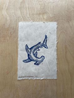 a piece of paper with a drawing of a shark on it