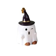 a white ceramic figurine with a black hat on it's head and eyes