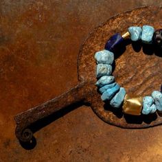 ANCIENT STONE BRACELET WITH 22K GOLD CLOSURE • DESIGNED AND HAND FORGED IN NEW YORK • STONES: TURQUOISE AND LAPIS • LENGTH: 7 INCHES Please email info@elihalili.com or call the studio at 212-941-7979 for any inquiries. York Stone, Hand Forged, 22k Gold, Stone Bracelet, Turquoise, Stone, Gold