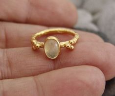 METAL: 925k Silver GEM: moonstone COATING: 24k gold over (We can made a special type of coating for your personal preference ) MATERIEL : 925K Sterling Silver ( Some of my items vermeil gold over silver for looks rich . But i can finish in silver too ) PAYMENT : We accept paypal payment RING SIZE: 6 (your desired size is made) SHIPPING PRICE AND DURATION: We are shipping worlwide. Your products are sent within 2 business days after the order. 1-3 working days to Europe United States 6-10 working Hallmarked Yellow Gold Moonstone Ring, Delicate Gold Moonstone Ring, Gold Delicate Moonstone Ring, Gold Sterling Silver Moonstone Ring As Gift, Handmade Gold Moonstone Ring In Sterling Silver, Handmade Yellow Gold Moonstone Ring In Sterling Silver, Minimalist Gold Moonstone Ring With Bezel Setting, Gold Moonstone Ring As Gift, Gold Moonstone Ring For Gift