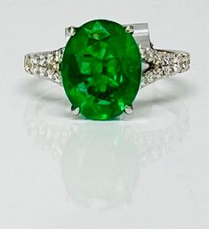 Vivid Oval Emerald and Diamond Ring – Seng Jewelers Oval Emerald Ring With Prong Setting In Platinum, Oval Platinum Emerald Ring With Prong Setting, Oval Tsavorite White Gold Ring, Oval Tsavorite Ring In White Gold, Oval Tsavorite Ring With Center Stone, Oval Emerald Ring With Accent Stones In Platinum, Classic Oval Tsavorite Ring, Oval Emerald Ring In White Gold, Luxury Oval Emerald Ring With Vs Clarity