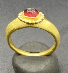 Ancient GREEK'S GOLD RING WITH GARNET STONE Signet Stamp. Beautiful Tree Leave Figure Is Engraved On Garnet Stamp Signet. Size And Details Pictures Are Listed Above. For Better View Of Stamp We Imprint The Stamp On Wax Clay As Shown In The Pictures. Ceremonial Yellow Gold Emerald Heirloom Ring, Ceremonial Heirloom Yellow Gold Emerald Ring, Luxury Yellow Gold Ruby Ring With Round Band, Traditional Gold Emerald Anniversary Ring, Traditional Ruby Ring In Yellow Gold, Heirloom Yellow Gold Emerald Cabochon Ring, Luxury Gold Emerald Round Ring, Luxury Gold Emerald Ring, Luxury Gold Oval Ruby Ring