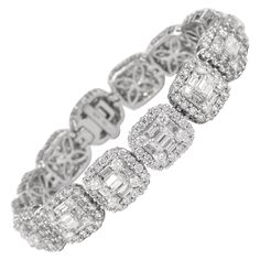 Sensational illusion set diamond bracelet with the look of emerald cut diamonds. High jewelry by Alexander Beverly Hills. 15.40 carats total of round and baguette cut diamonds. Approximately G/H color and VS clarity. 18k white gold, 6.25in. Accommodated with an up-to-date digital appraisal by a GIA G.G. once purchased, upon request. Please contact us with any questions. Item Number B3579 Modern Diamond Jewelry, Bling Bra, White Gold Diamond Bracelet, Trillion Diamonds, Peridot Bracelet, Malachite Bracelet, Expensive Jewelry Luxury, Gold Bracelet Set, Set Bracelet