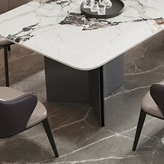 a marble dining table with chairs around it