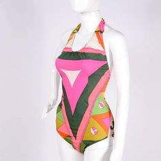 For Sale on 1stdibs - This is a fabulous vintage Pucci swimsuit from the late 1960's. The suit fits a size Medium and has the Emilio Pucci signature print and the Emilio Pucci Retro One-piece Swimwear For Vacation, Retro One-piece Swimwear For Beach, Vintage Green Swimwear For Summer, Retro Halter Neck Fitted Swimwear, Vintage Green Summer Swimwear, Chic Multicolor Printed Swimwear, Vintage Green Fitted Swimwear, Retro Summer Swimwear Lined, Retro Lined Swimwear For Summer