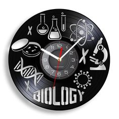 a clock with the words biology printed on it's face and symbols surrounding it