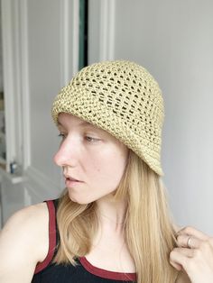 This bucket / cloche hat was hand crocheted by me using premium organic cotton yarn with a superb texture. It has a natural silky feel to it, and the colour is a very light mustard - custard . Easy to wash and dry, protects well from the sun. Has a 20's vibe ! Summer Knitted Brimmed Cloche Hat, Handmade Yarn Cloche Hat For Summer, Summer Handmade Yarn Cloche Hat, Spring Crochet Cloche Hat In One Size, Handmade Summer Yarn Cloche Hat, Crochet Cotton Yarn Bucket Hat For Spring, Hand Knitted Yarn Bucket Hat For Summer, Spring Cotton Yarn Crochet Bucket Hat, Beige Cotton Yarn Hat With Crochet