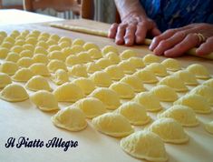 a person is making lemons on a table with a rolling pin in front of them