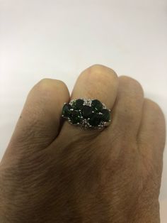 Deep green Chrome Diopside 925 Sterling silver with rhodium finish Size 7 Can be re sized for a jeweler's fee of $10 All rings are shipped in a nice gift box. Check out our over a THOUSAND great reviews Engraving is $4 per letter and is not always perfect depending on the piece. It can take a few days if the jeweler is busy. This is payable to Paypal Judithsltd@gmail.com Sterling Silver Multi-stone Green Emerald Ring, Green Multi-stone Emerald Ring In Sterling Silver, Anniversary Green Sterling Silver Ring, Green Multi-stone Sterling Silver Rings, Gothic Ring, Green Chrome, Gothic Rings, Multi Stone Ring, Multi Stone