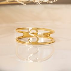 Elisse Personalize your everyday ring with your letter of choice! This modern split band design catches the light beautifully and is very comfortable for everyday wear and even next to other rings. The top and bottom are flat, so you can even stack other rings on top or below it! - Handmade- Solid Gold- Size of Each Band: 1.5 mm- Letter Size: 6 mm * Personalized jewelry is non-refundable. Please confirm with us before ordering if you want more than one letter. All pieces come beautifully boxed i Ring Simple Gold, Simple Gold Ring, Dainty Gold Ring, Gold Initial Ring, Gold Rings Simple, Dainty Gold Rings, Everyday Ring, Letter Ring, Monogram Ring