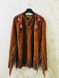 Fall Leather Jacket With Tassels And Long Sleeves, Leather Jacket With Suede Overlays, Winter Leather Jacket With Tassels, Winter Leather Jacket With Tassels Long Sleeve, Bohemian Long Sleeve Leather Jacket For Fall, Bohemian Long-sleeve Leather Jacket For Fall, Winter Leather Tassel Outerwear, Winter Leather Outerwear With Tassels, Fall Leather Tassel Outerwear