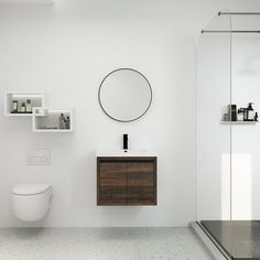 a bathroom with a toilet, sink and shower stall in it's white walls