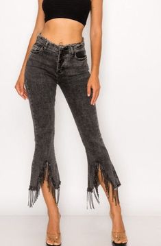 These trendy and fun denim pants are the perfect combination of style and comfort! Sparkling with rhinestones and flirty fringe, you'll make heads turn with their unique raw hem and classic 5 pocket design. Plus, they've got a zip and button closure, plus belt loops to boot, so you'll be ready to rock 'n' roll in no time! 1365P High Waist Stretch Cropped Jeans With Frayed Hem, Stretch Flare Jeans With Frayed Hem And Cropped Leg, Fall Denim Pants With Frayed Hem, Trendy Stretch Jeans With Frayed Hem, Mid-rise Pants With Frayed Hem For Fall, Stretch Pants With Frayed Hem For Fall, Chic Dark Wash Pants With Frayed Hem, Stretch Flare Pants With Frayed Hem, Cropped Stretch Pants With Frayed Hem