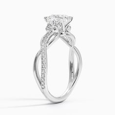 a white gold engagement ring with an oval cut diamond