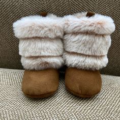 Cute Little Winter Booties To Keep Your Little Warm And Stylish! Super Soft Faux Fur And Faux Suede Boot Are Perfect For Cold Weather Outings. Easy On And Off With Velcro Closure For Snug Fit. Size 3-6 Months. Never Worn. Cute Brown Round Toe Slippers, Soft Cream Round Toe Slippers, Winter Beige Closed Toe Booties, Beige Closed Toe Winter Booties, Cute Brown Booties For Playtime, Winter Booties With Soft Sole And Closed Toe, Comfortable Soft Booties For Playtime, White Winter Booties For Playtime, Winter White Booties For Playtime