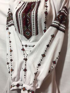 This is beautiful Ukrainian dress for the modern woman. US&CA Size - XS, S, M, L in stock. Style of embroidery - nyzynka stitching. Many colours ornament. Adjustable straps on the neck. Sleeve length - long. White cotton dress. Ukrainian clothing. Rich and nice embroidery. Your look would be best with our dress. Dress. Ukrainian Vyshyvanka. Ethnic clothing. Handmade embroidery. Ukrainian dress. Handmade dress. WhatsApp/Viber +38 0976620513 Instagram: Savchuk_Design_Embroidery Vyshyvanka Ukraine, Embroidered Blouses, Ukrainian Vyshyvanka, Ukrainian Clothing, Ukrainian Dress, Dress Book, White Cotton Dress, Fashion Design Dress, Handmade Dress