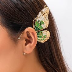 Feeling fanciful? Get your wings with the Sabrina Bufferfly Single Ear Cuff! This chic piece of bling comes in three jewel-toned colors, so you can make your 'fly' fashion statement whether you're out on the town or just chillin' with your buds. (Just don't let any of them borrow it!). Single Piece. Gender: Women Item Type: Earrings, Ear Cuff Metals Type: Iron alloy Material: Iron+Water Diamond+Drip Oil Material: Rhinestone Feather Ear Cuff, Ear Cuff Piercing, Iron Water, Elf Ear Cuff, Fake Earrings, Butterfly Fashion, Big Butterfly, Metal Butterfly, Gothic Punk