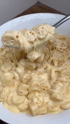 a white bowl filled with macaroni and cheese