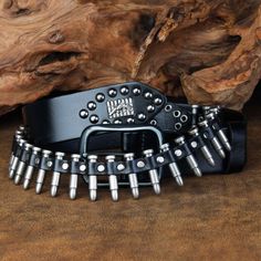 Rock 'n reload When you're shooting for that outlaw bandit look, it's time to rock this genuine leather belt that looks like a bandolier loaded with bullets.It comes in four colors and three sizes, and is also studded with skull and crossbones, and a design featuring a gun in front of a row of bullets.The buckle and bullets are metal alloy, and the belt is 3.8 cm (1.18 in.) wide.Rock it and you'll never run out of ammo, or have to ask yourself "did I fire six shots or only five?" Plays well with Bullet Belt, Belt Collection, Belt Ring, Metal Belt, Shoe Boot Sandals, Skull And Crossbones, Genuine Leather Belt, Fashion Pattern, Sierra Leone